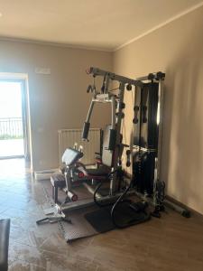 a room with a gym with several exercise bikes at I luoghi di Lisetta in Montefusco