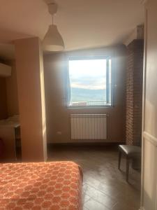 a bedroom with a bed and a window at I luoghi di Lisetta in Montefusco +2 photos