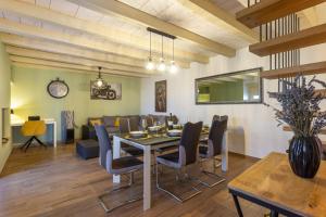 a dining room and living room with a table and chairs at Casa Cassianus - Happy Rentals in Sveti Petar u Šumi