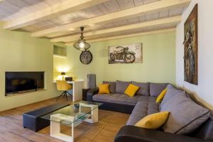 a living room with a couch and a table at Casa Cassianus - Happy Rentals in Sveti Petar u Šumi