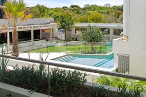 an external view of a house with a swimming pool at Casa Oasis Beachfront at Bokarina in Bokarina