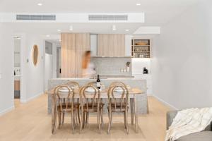 a kitchen and dining room with a table and chairs at Casa Oasis Beachfront at Bokarina in Bokarina +43 photos