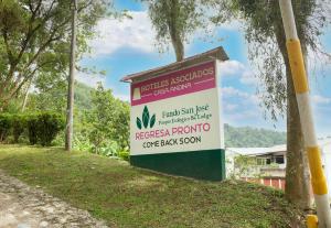 a sign for a hospital in a park at Fundo San Jose Parque Ecológico & Lodge Hotel Asociado Casa Andina in La Merced