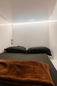 a bedroom with a bed with a brown blanket at Shams Wa Bahar Vacation Homes Rental in Dubai