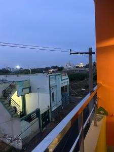 a view of a building from a balcony at Gugan home stay in Tiruchchendūr +5 photos