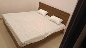 Postel nebo postele na pokoji v ubytování Hotel O Haven Palace