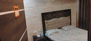 Ένα ή περισσότερα κρεβάτια σε δωμάτιο στο Hotel O Shere E Punjab