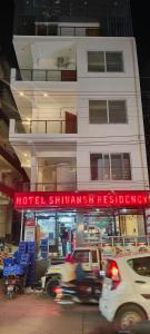 a building with a hotel shimani restaurant on a street at Hotel shivansh Residency in Rishīkesh