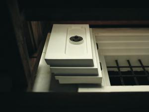 a white stove top oven sitting inside of a room at Komado ベンガラ in Komatsu