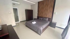 Ένα ή περισσότερα κρεβάτια σε δωμάτιο στο Semilang House