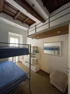 a bedroom with a bunk bed and a loft at La bella Flora in Ariccia