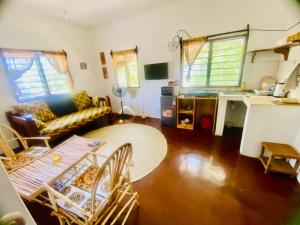 a living room with a couch and a table at Mkayamba House in Malindi
