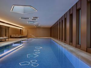 a swimming pool in a hotel room at Theatron Jerusalem Hotel & Spa - MGallery Collection in Jerusalem