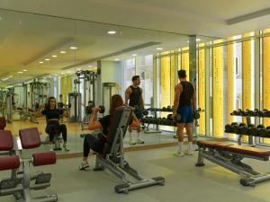 a group of people at a gym in front of a mirror at Adagio Doha in Doha