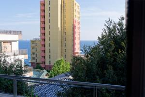 a view of a tall building from a balcony at 熱海の隠れ里 in Atami