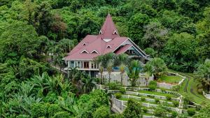 an aerial view of a house with a roof at The Diamond Villa, Pool & Jacuzzi with Panoramic Views in Pantai Cenang