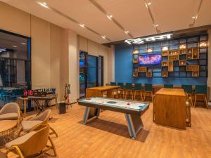 a room with a ping pong table and chairs at ibis Thane - An Accor Brand in Thane