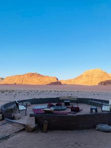 a picnic area in the middle of the desert at Wadi Rum Red Desert in Wadi Rum