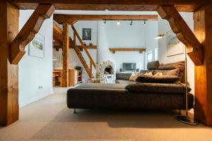 a living room with a couch and a fireplace at Haus Gerlinde in Drachselsried