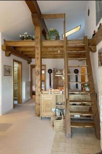 a room with a spiral staircase in a house at Haus Gerlinde in Drachselsried