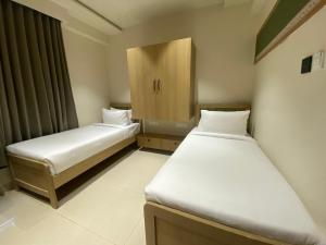 Ένα ή περισσότερα κρεβάτια σε δωμάτιο στο Sasya Elegance - A Boutique Hotel +3 φωτογραφίες