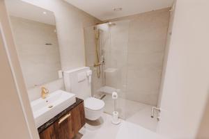 a bathroom with a toilet and a sink and a shower at Wine & boutique hotel Terbotz in Štrigova
