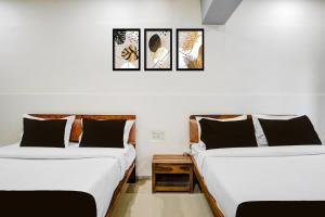 Ένα ή περισσότερα κρεβάτια σε δωμάτιο στο Collection O Sabarmati River Gandhinagar Formerly Hotel Royal Park