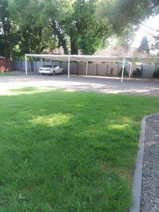 a parking lot with a car parked in a yard at Columbae Guesthouse in Parys