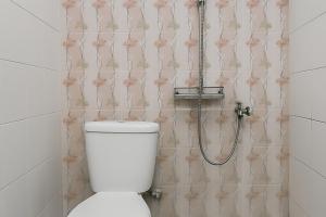 a bathroom with a toilet and a shower at RedDoorz Syariah at Serenity Guesthouse Subang in Subang +16 photos
