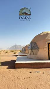 a group of domes in the middle of the desert at DARA RUM lUXURY CAMP in Wadi Rum