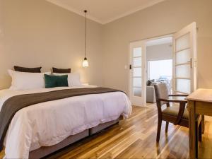 Postel nebo postele na pokoji v ubytování Water View Villas - Millwood Premium Apartment + 2 fotografie