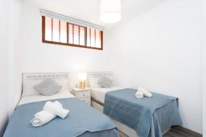 Ένα ή περισσότερα κρεβάτια σε δωμάτιο στο Apartment Beautiful Sea View Las Vistas +18 φωτογραφίες