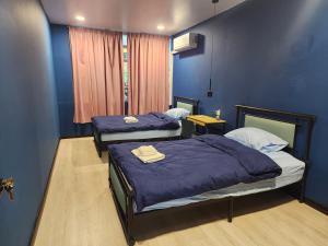 Krevet ili kreveti u jedinici u okviru objekta The Cozy Haven at 83c Jalan Masjid Lama