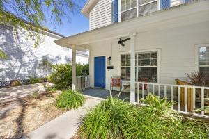 a white house with a blue door at 322 S, 5th Street Unit A townhouse in Fernandina Beach