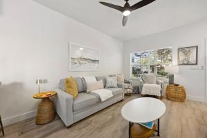 a living room with a couch and a table at 322 S, 5th Street Unit A townhouse in Fernandina Beach +24 photos