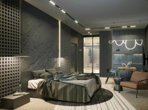 ein Schlafzimmer mit einem großen Bett und einem Stuhl in der Unterkunft West Baltic City in Stettin