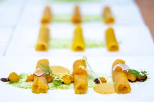 a plate with some food on a white surface at Warias Hotel am Geiseltalsee - Nähe Merseburg und Mücheln in Braunsbedra
