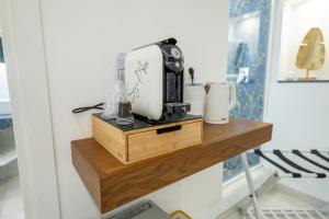Příslušenství pro přípravu čaje a kávy v ubytování MARIDDA-experience rooms- + 39 fotografií