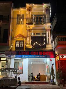 a building with a sign that reads luana chill motel at Linh Chi Hotel in Mù Cang Chải +23 photos