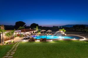 an image of a swimming pool at night at Vento Estivo Mansion in Pastida