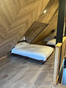 two beds in a room with wooden ceilings at BOTH ISUMI - Vacation STAY 06710v in Isumi