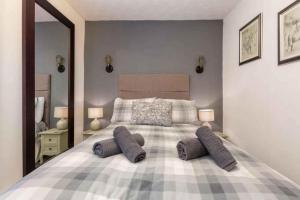 a bedroom with a large bed with pillows on it at White Swallow Hotel in Blackpool +26 photos