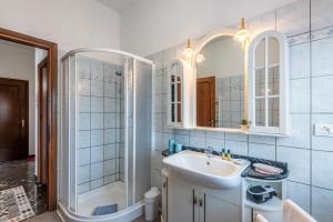 a bathroom with a sink and a shower at Agriturismo Osea in Monteriggioni +49 photos