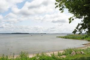 a view of a lake with boats in the water at Ferienwohnung mit Dachterrasse Kamin nahe dem Strelasund in Franken Vorstadt