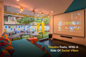 a childrens play room with a large screen at goSTOPS Goa, Baga in Baga