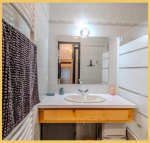 a bathroom with a sink and a mirror at Le Paradisio I Studio I Morzine in Morzine +20 photos