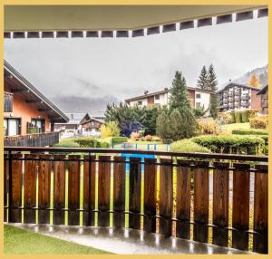 a bridge over a river with houses at Le Paradisio I Studio I Morzine in Morzine