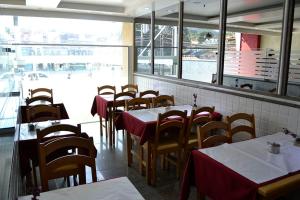 a row of tables and chairs in a restaurant at Hotel Barao Da Taquara in Rio de Janeiro