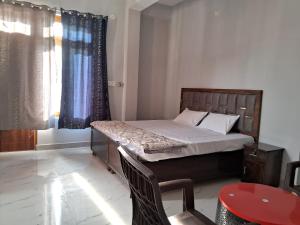 Ένα ή περισσότερα κρεβάτια σε δωμάτιο στο AAAC HoME STAY