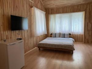 Postel nebo postele na pokoji v ubytování Gold Boutique Apart & Hotel